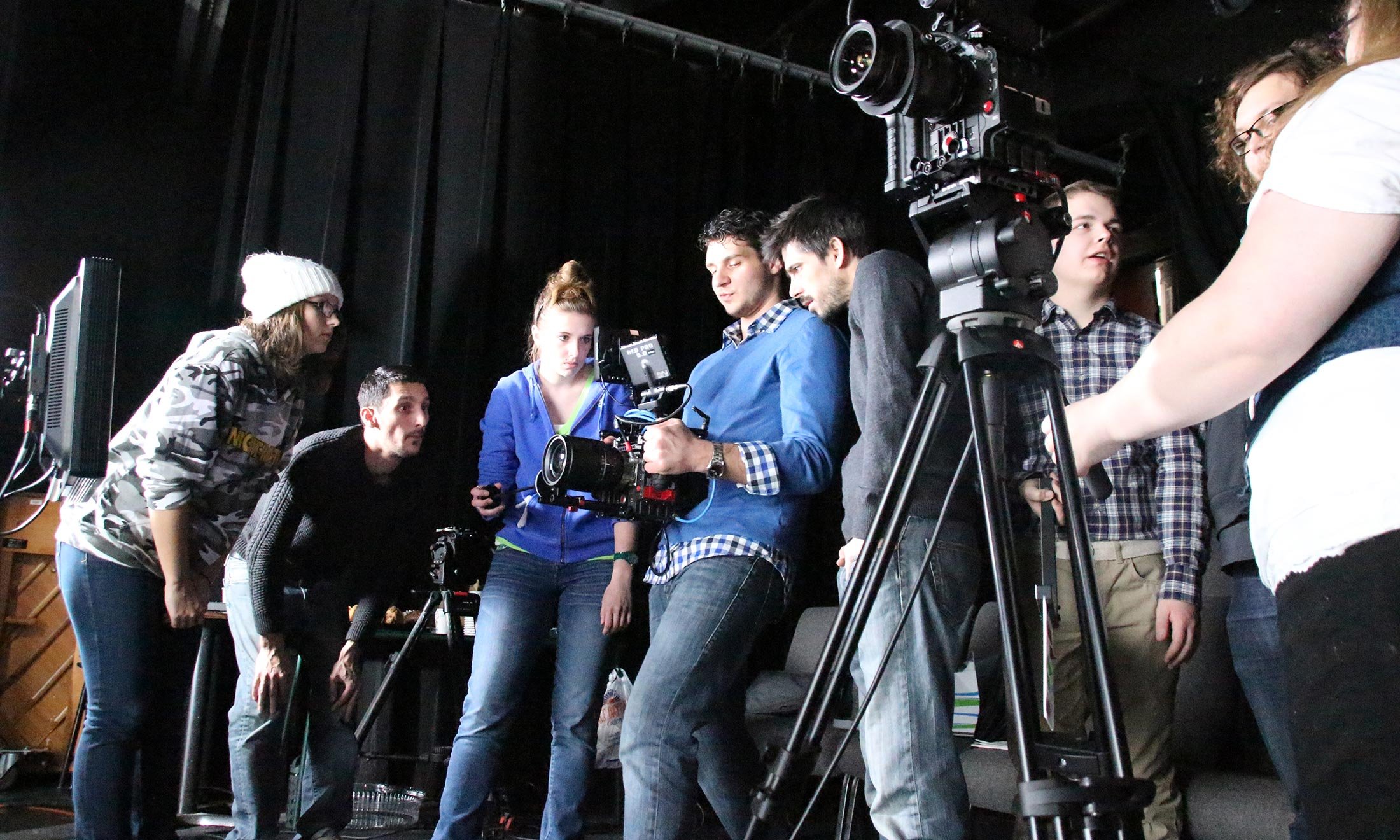Oakland University film students help direct a shoot in the production room