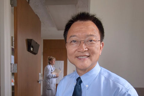 Ziaodong Deng, Ph.D., in a doctor's office