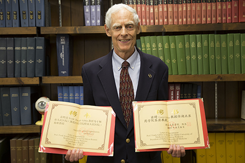 Below, Dr. Frank Giblin holds his letters of appointment as visit professor at Shiyan Renmin Hospital and Hubei University of Medicine. 