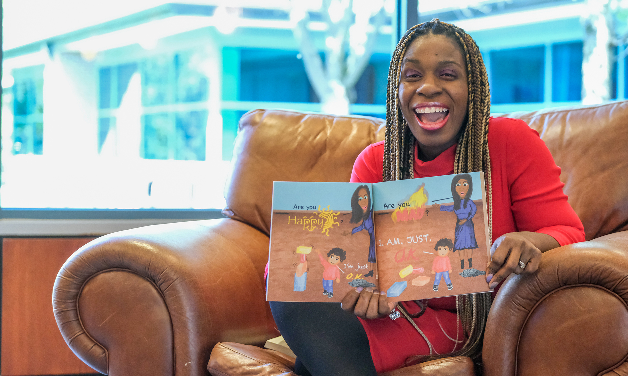A person holding open a children's book
