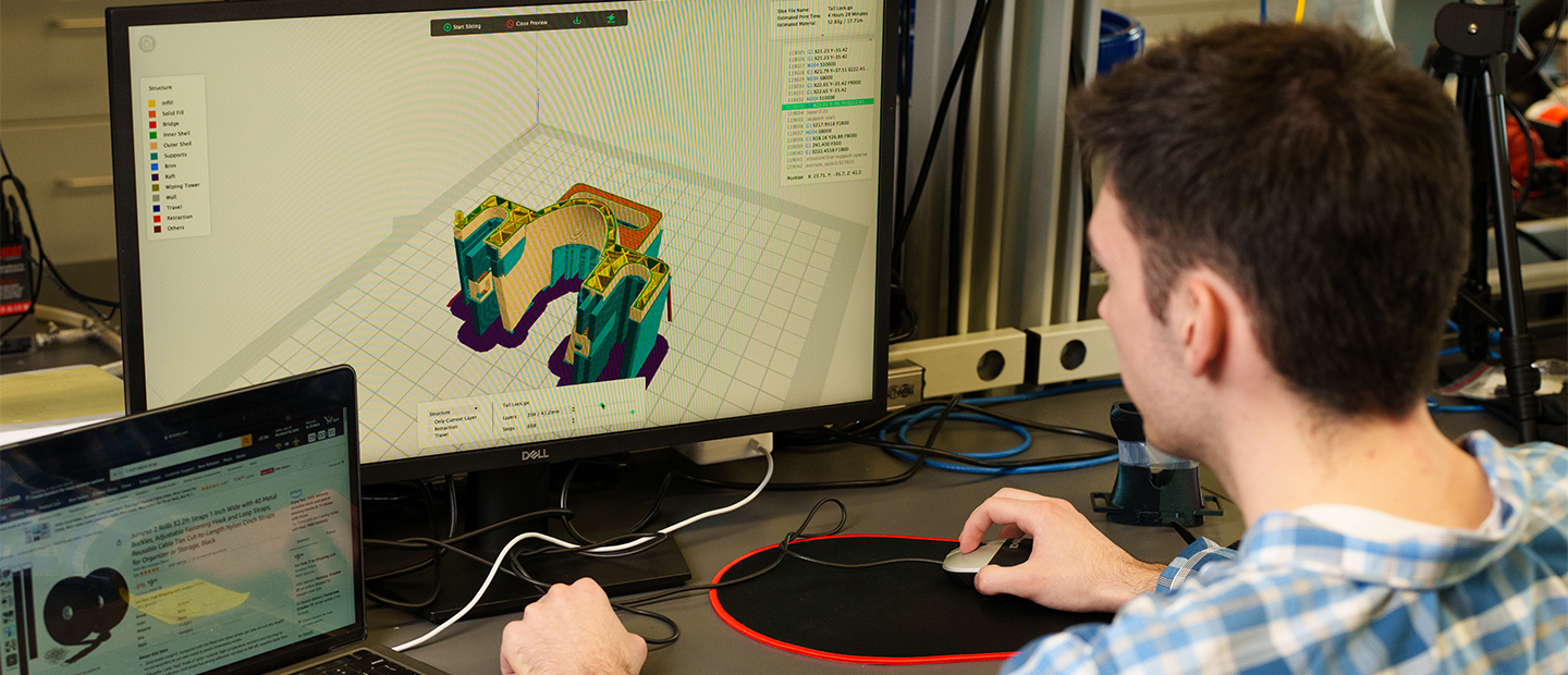A young man working at a computer
