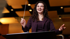 Madeleine Krick conducting a musical group