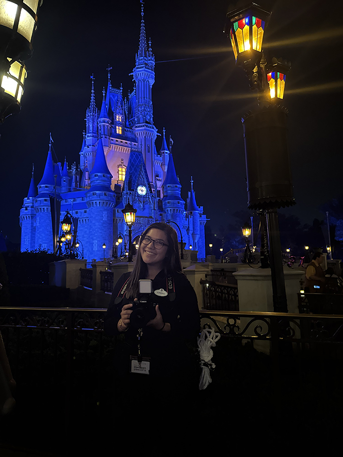 Jordan Hung poses for a photo in front of the Disney World castle.