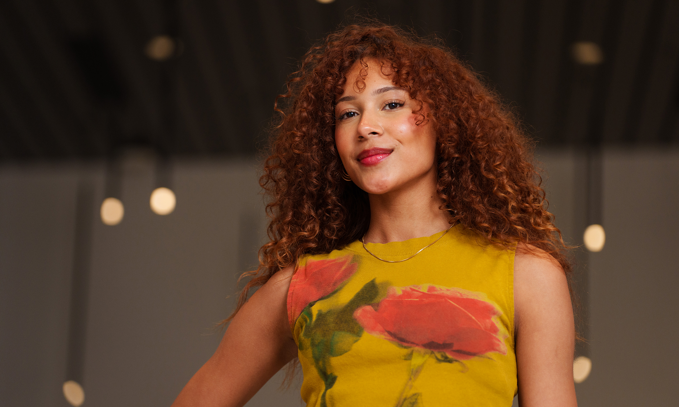 Cali Hill poses for a photo in the Varner Hall lobby.