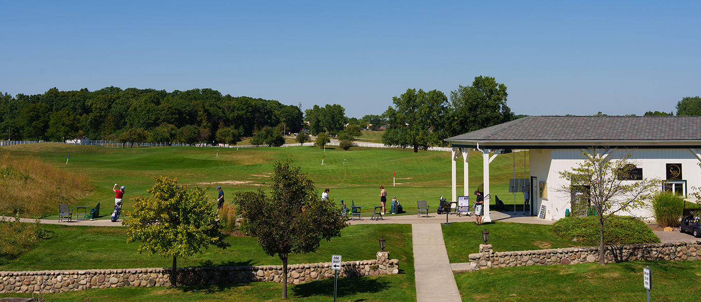 People golfing at one of the Oakland University golf courses