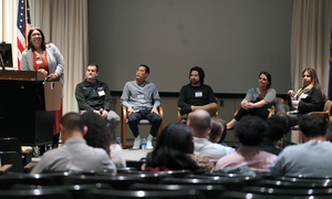 Participants on stage during the alumni panel
