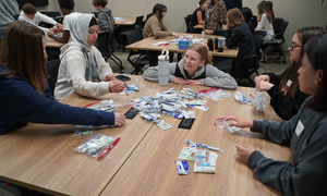 An OUWB student talking to youth