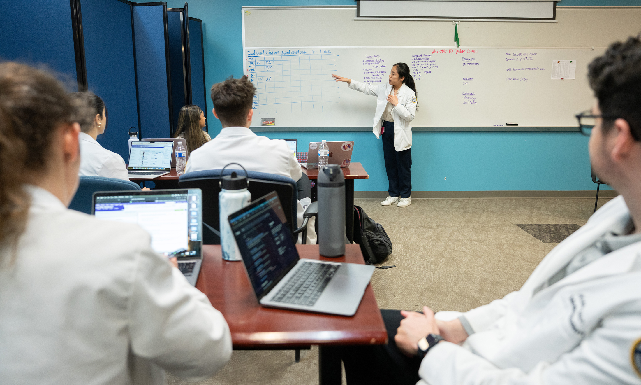 An image of a student at a whiteboard
