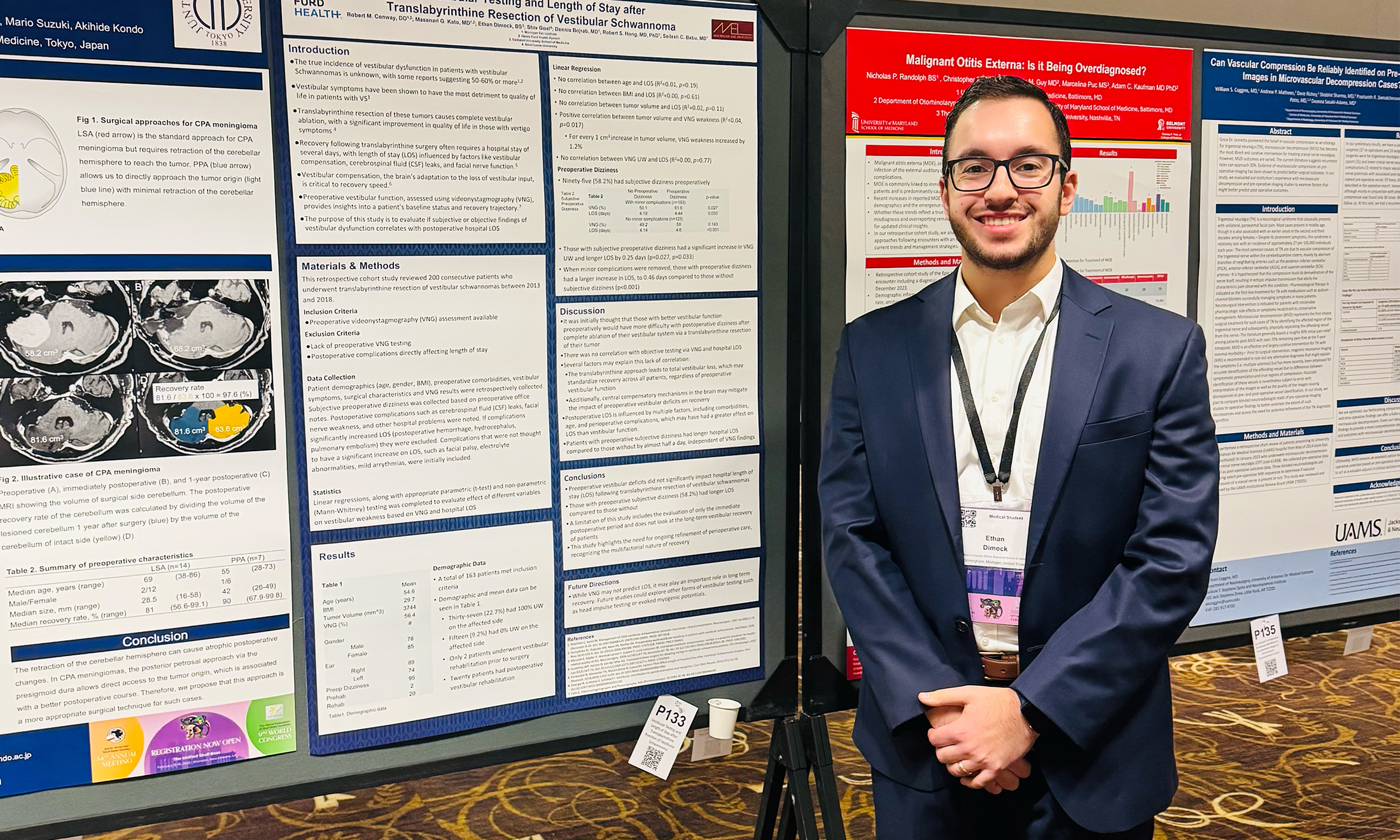 An image of a student in front of a poster