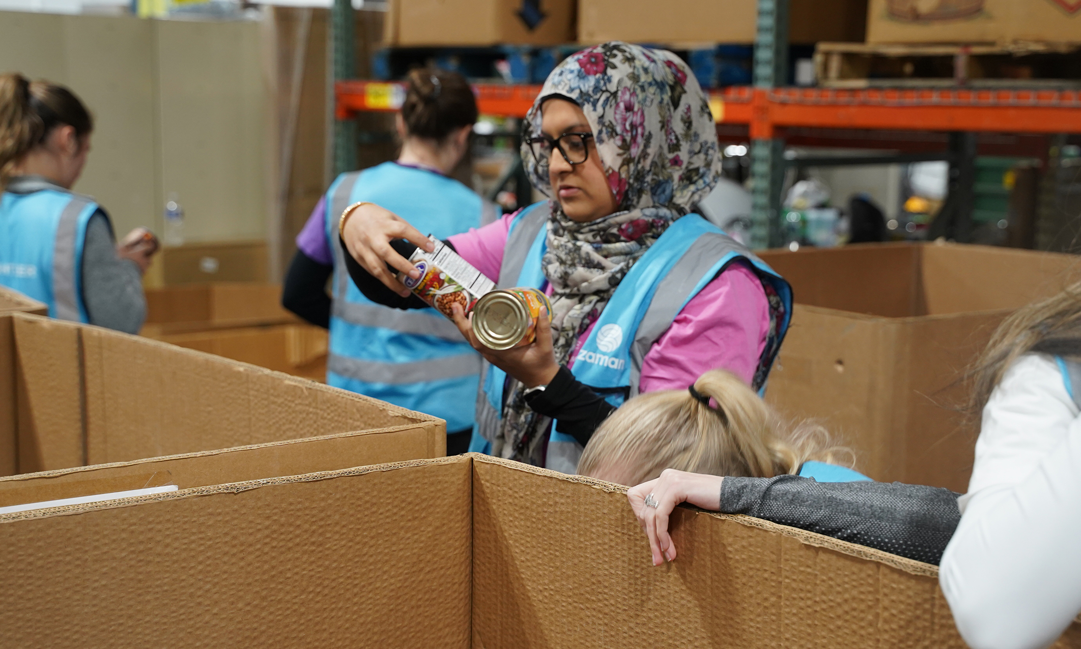 Nabeeha Shakil-Ahmad sorts food during an OUWB Day of Service