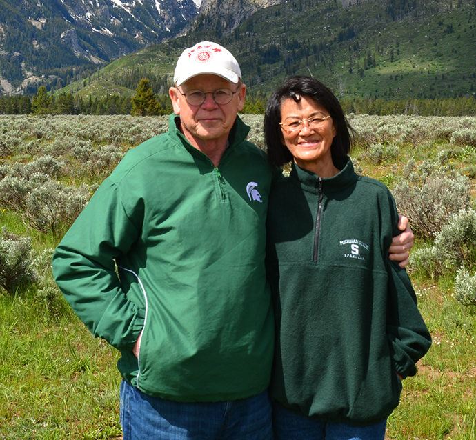 Chris and Marie King outside by the mountains
