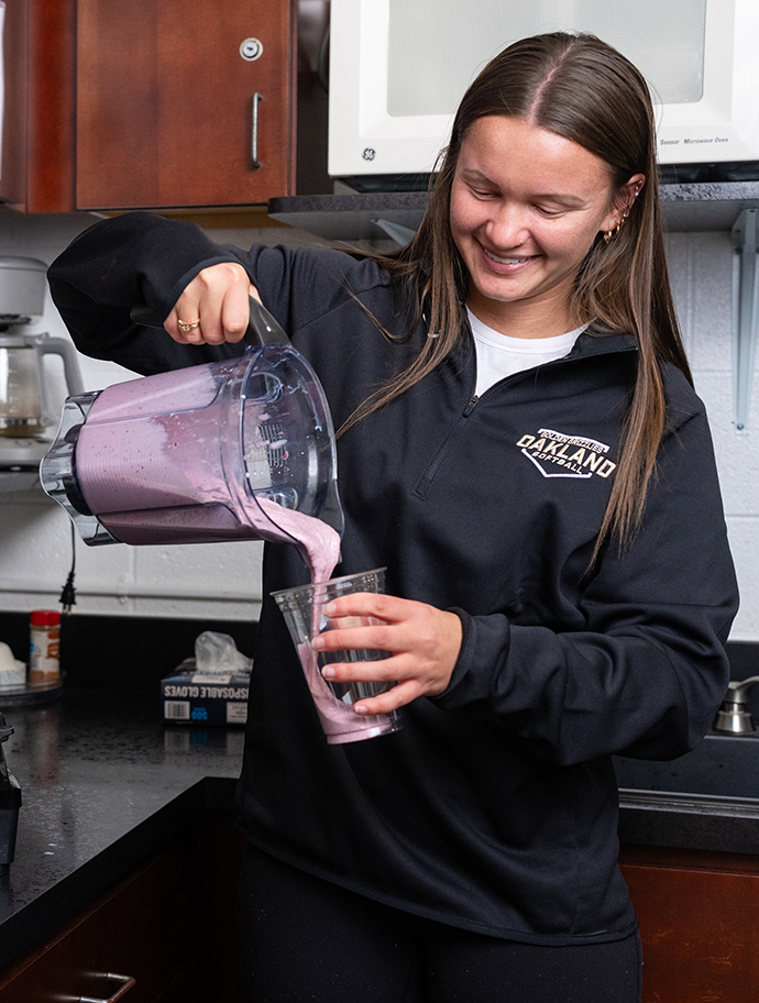 Mary pours a smoothie