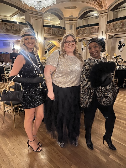 People posing for a photo at a formal dancing event