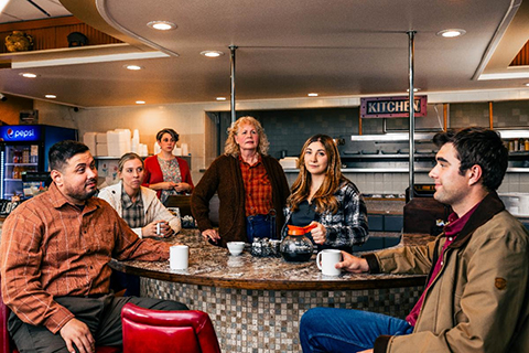 A group of people at a restaurant table.