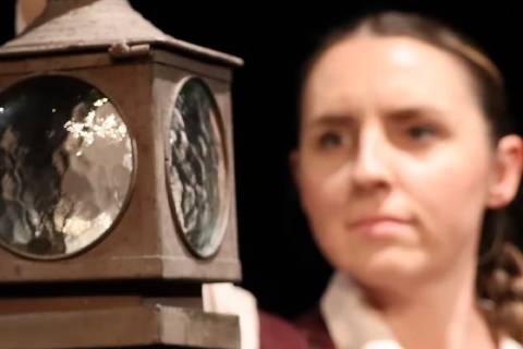 Anna Kamryn Marck holding lantern