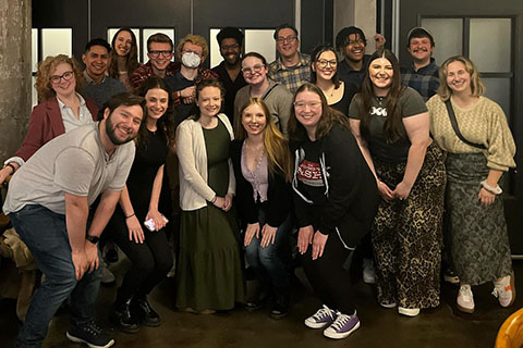 A group of people smiling.