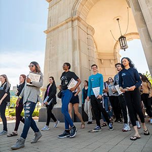 Students walking near Elliott Tower on O U campus.
