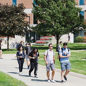 A group of students walking on O U campus.