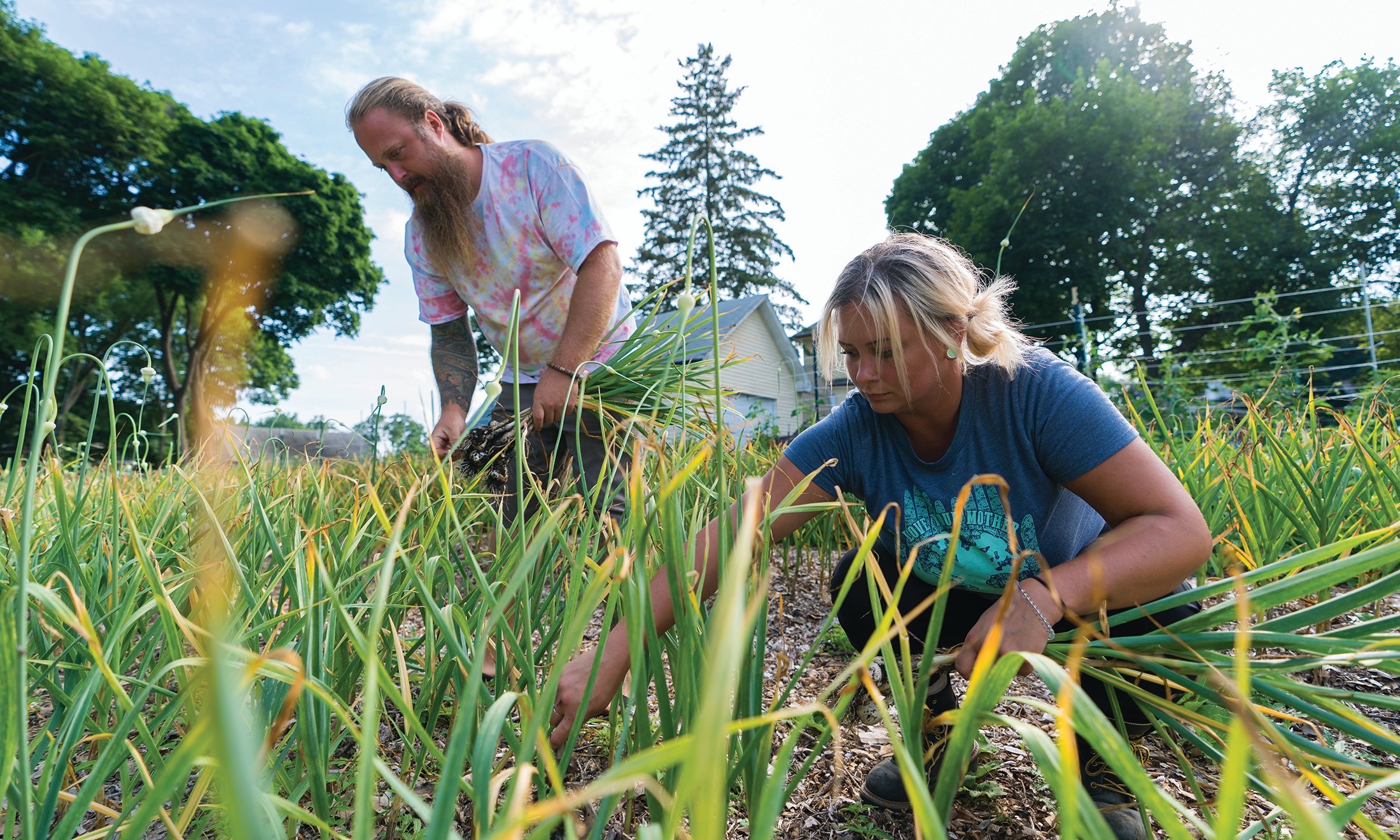 A man and women in a garden.
