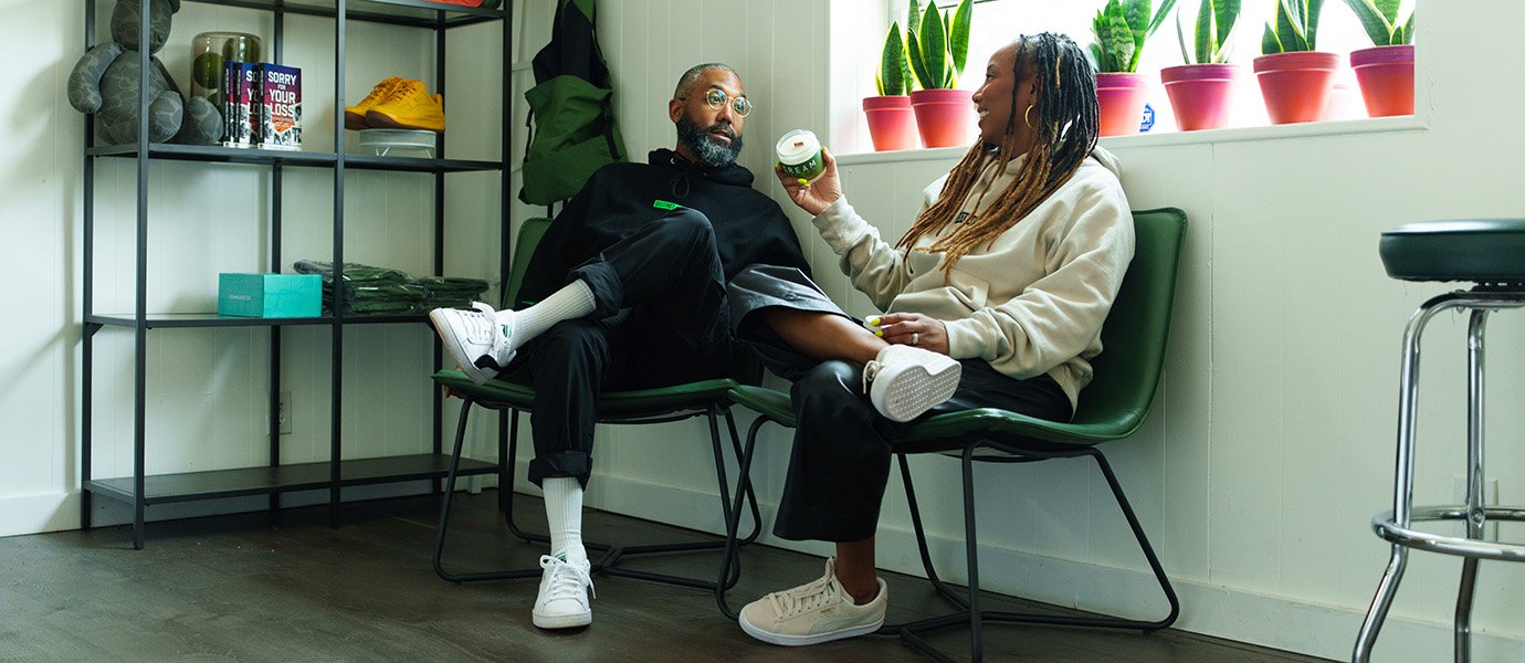 Two people sitting and talking