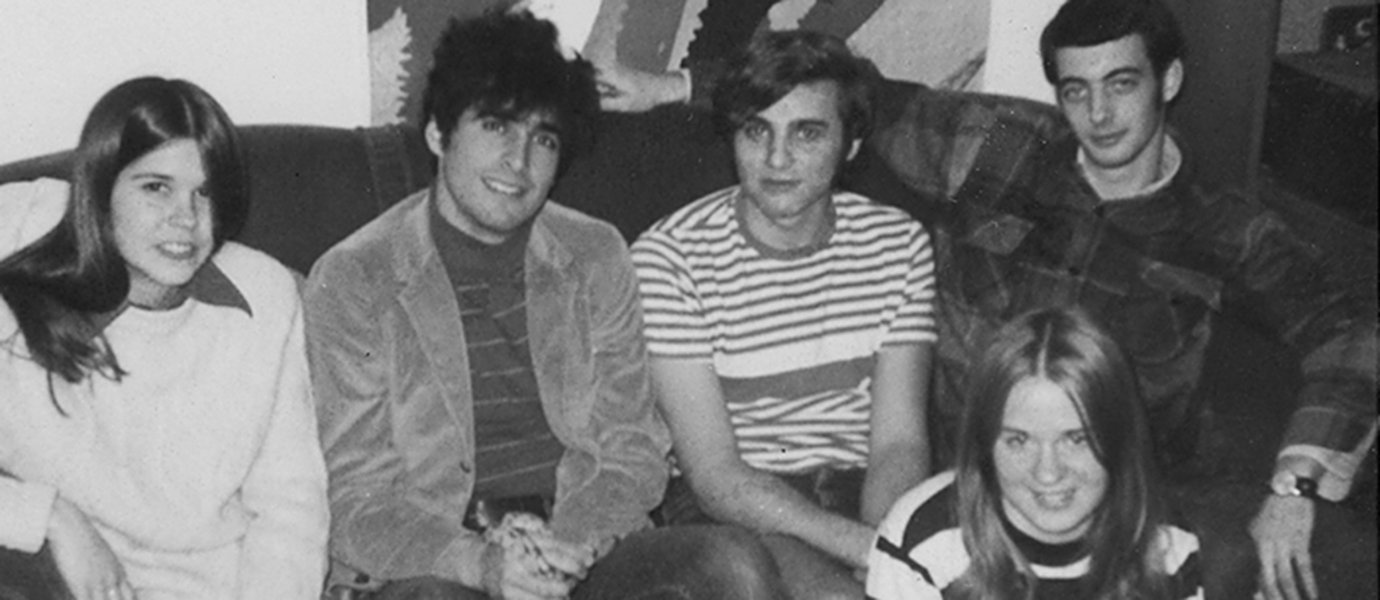 Five people smiling for a photo