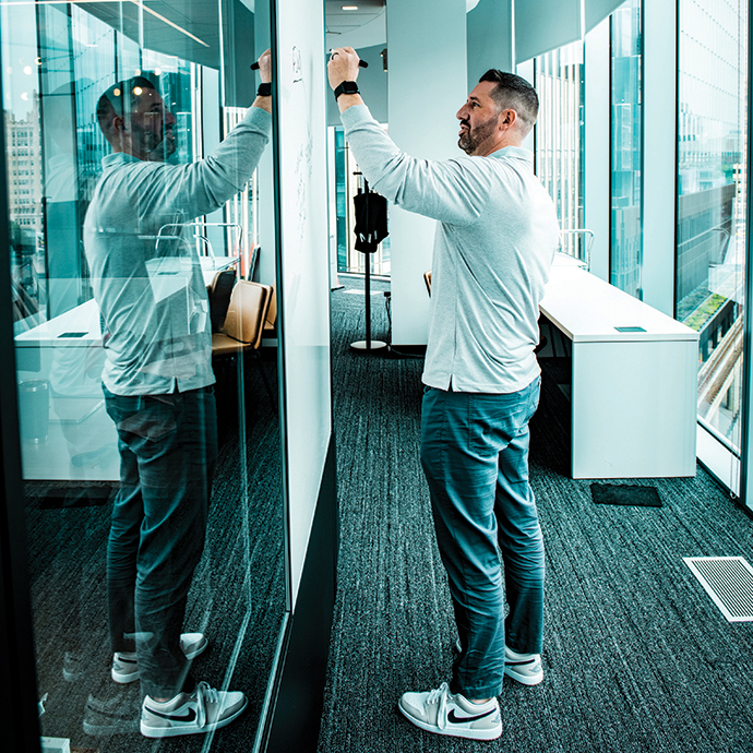 Man writing on white board
