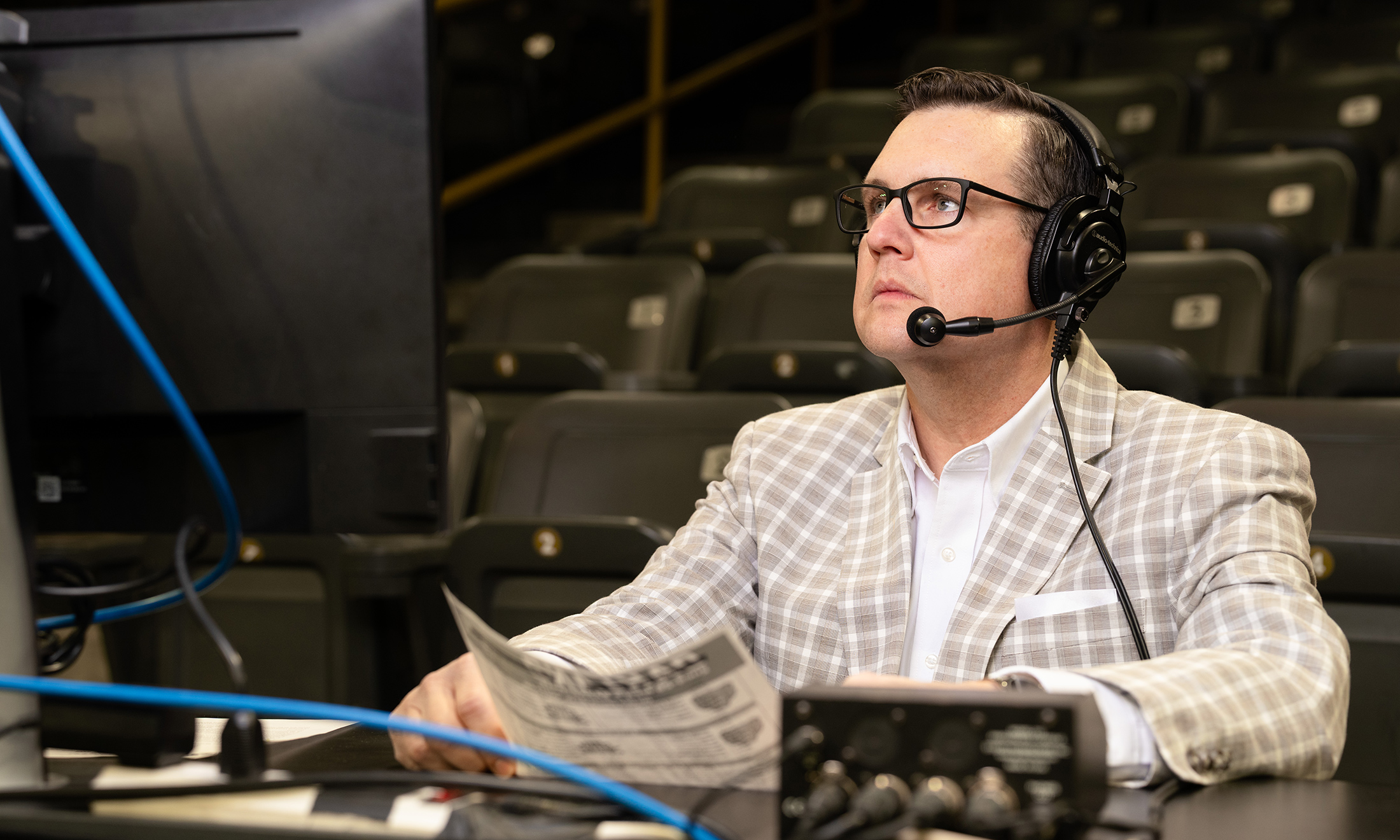 Man sitting at a desk wearing a headset