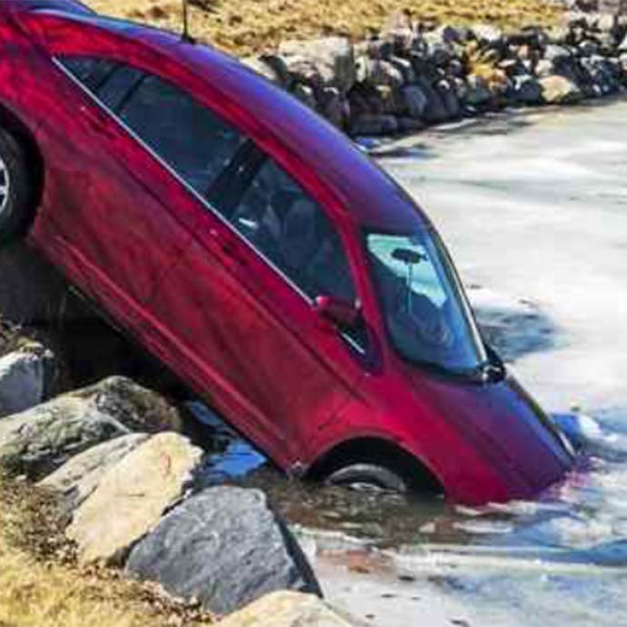 Red car in lake