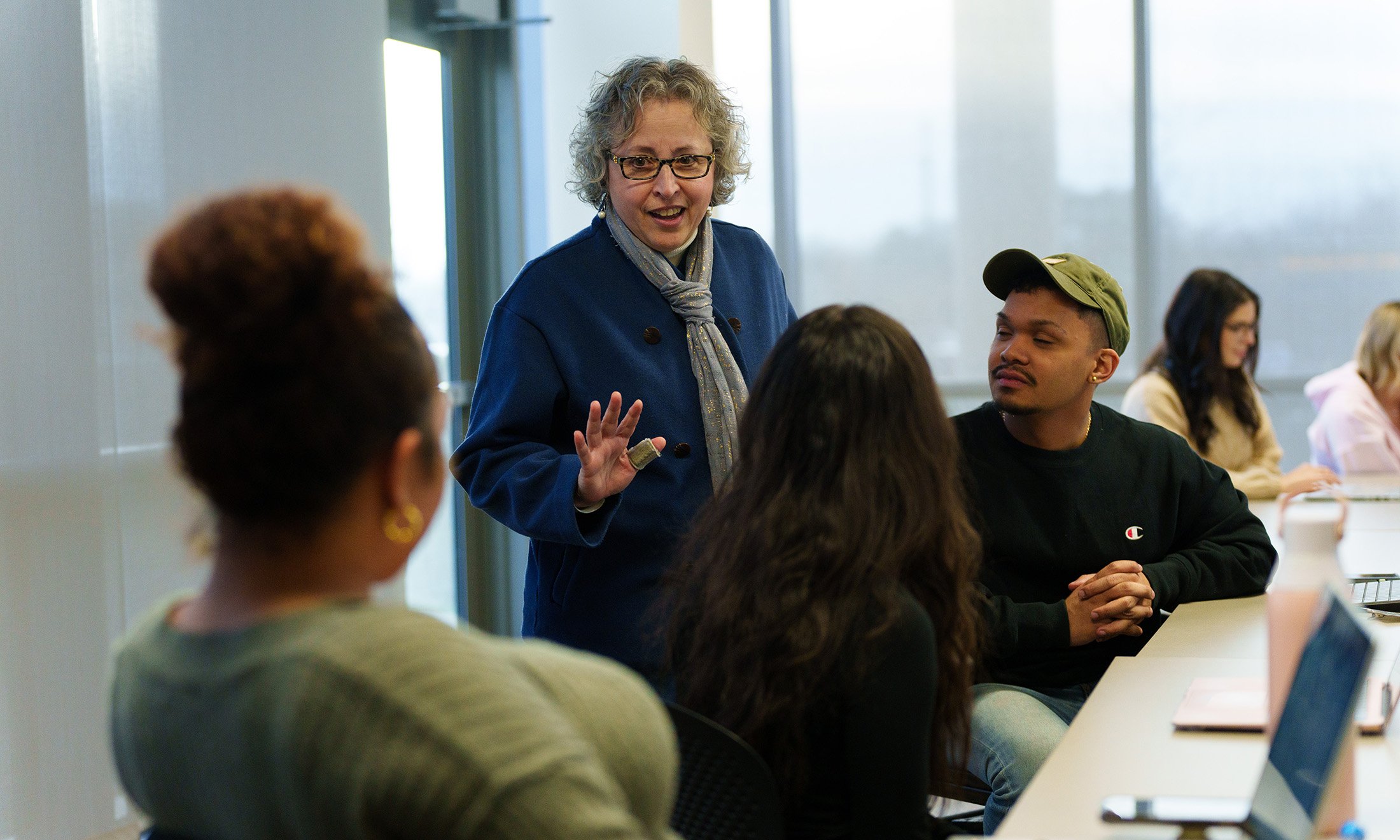 A professor talking to students