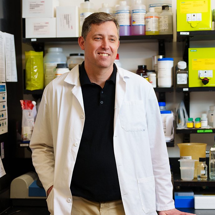 A man standing in front of medical supplies