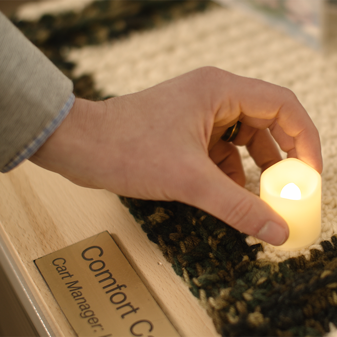 Hand setting down flameless candle