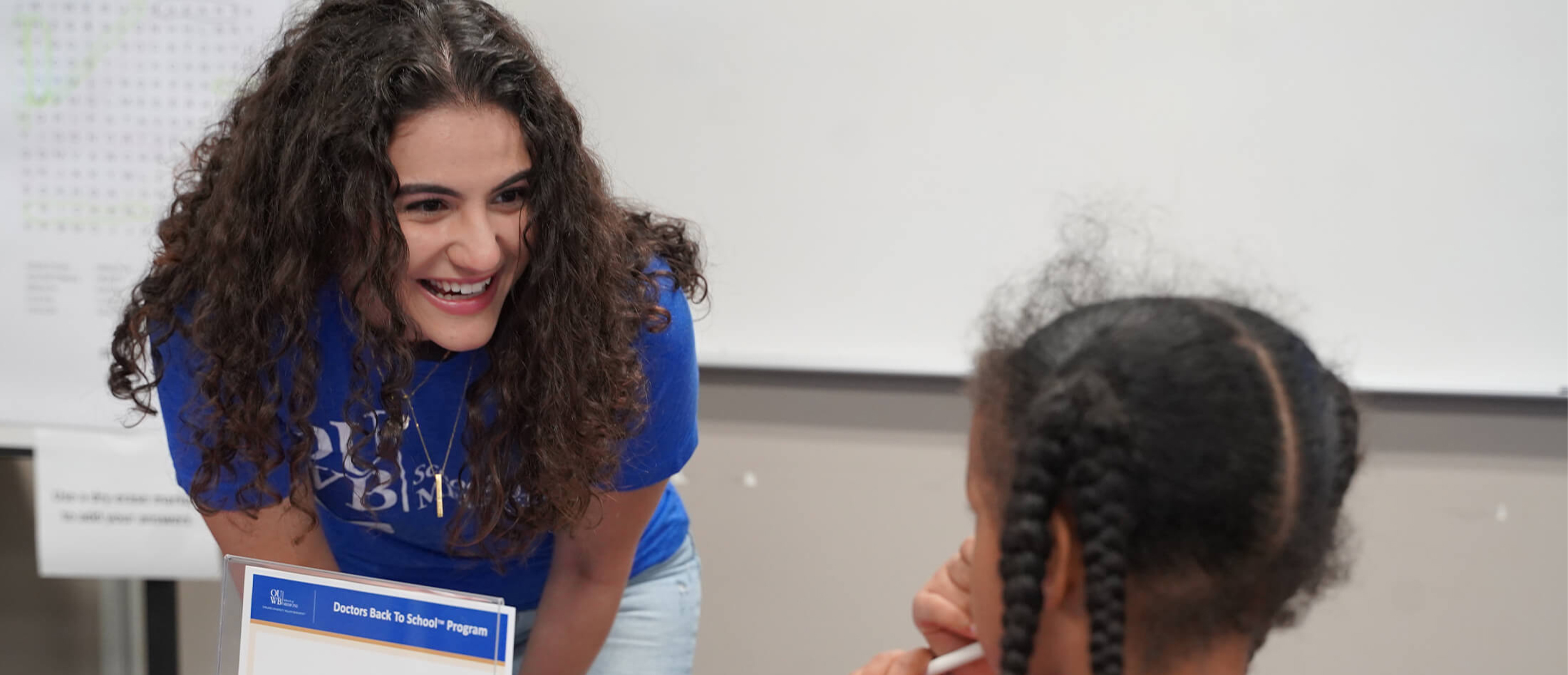 An image of an OUWB student at a community event