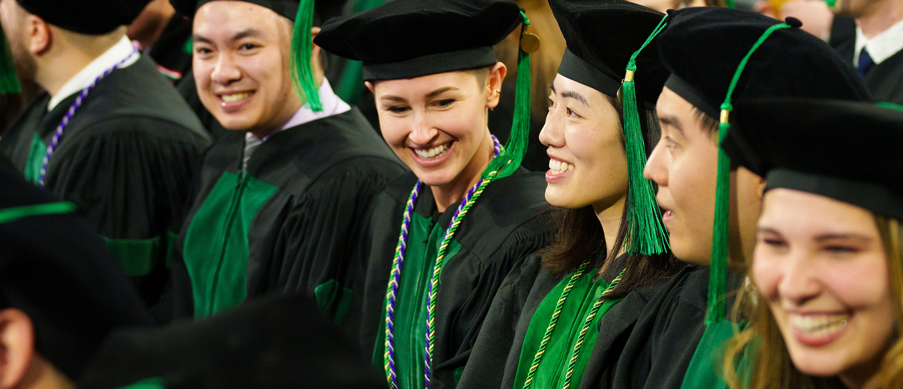 An image of OUWB students smiling at commencement