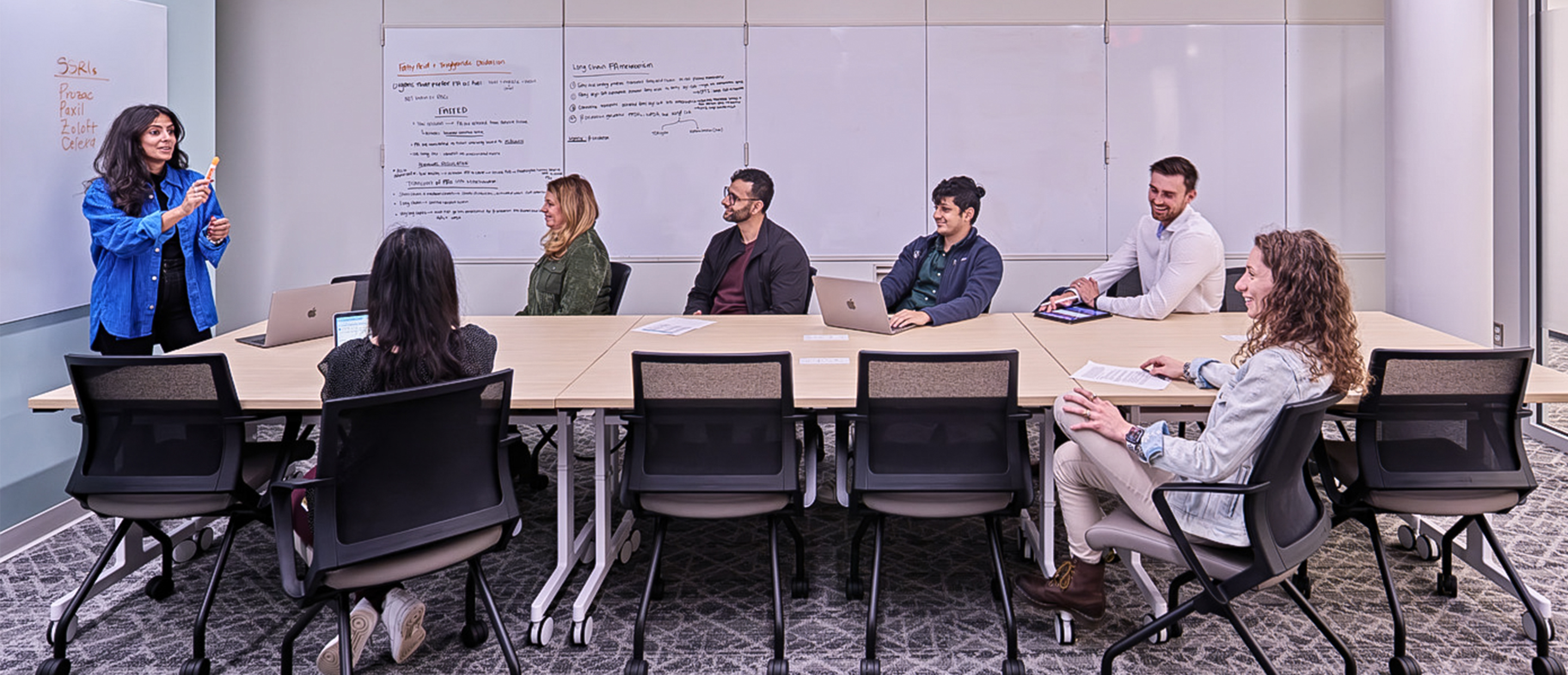 An image of students in a conference room