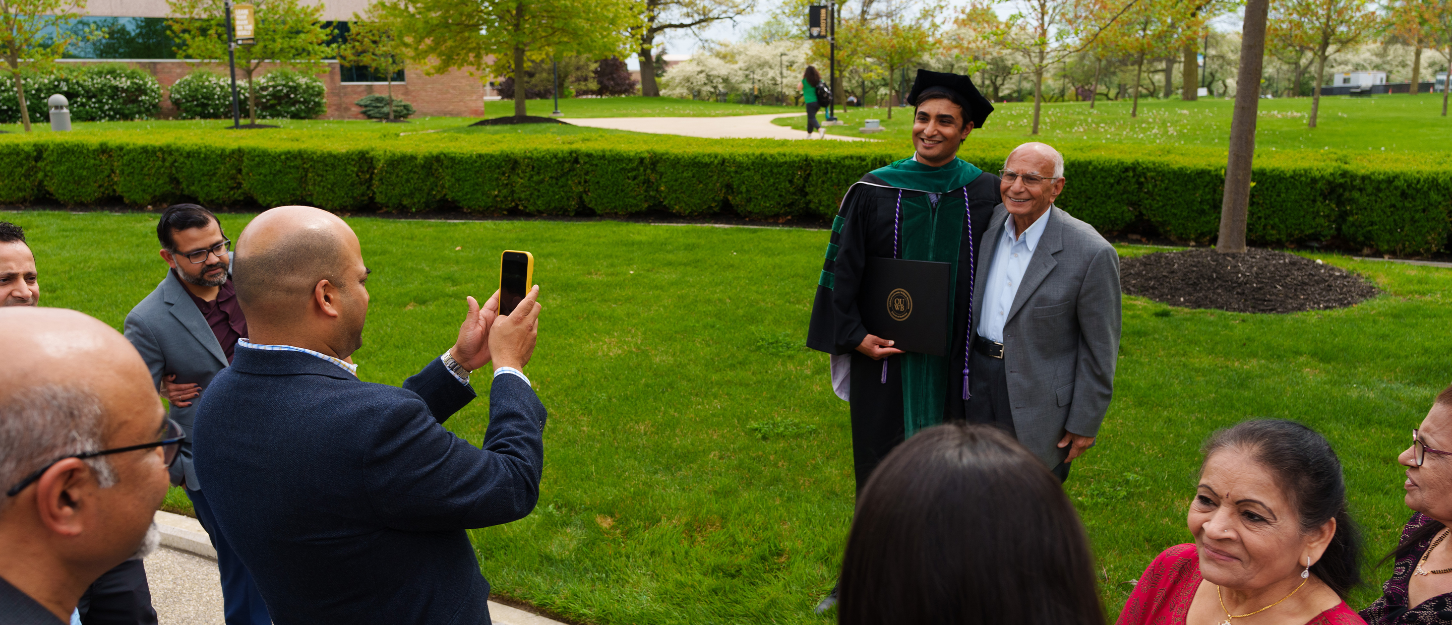 An image of an OUWB family after commencement