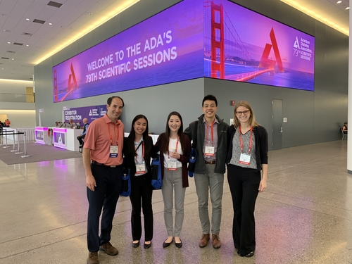 An image of an OUWB group at a conference