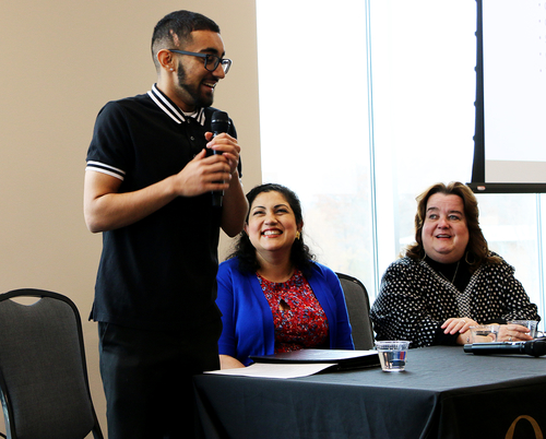 Jay Amin talks during a recent event held at the Oakland Center in conjunction with Transgender Day of Remembrance. His mother, Tejinder Gill (center), and pediatrician, Maureen Kelly, M.D. listen to his presentation.