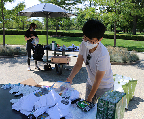 An image of a student packing a care kit