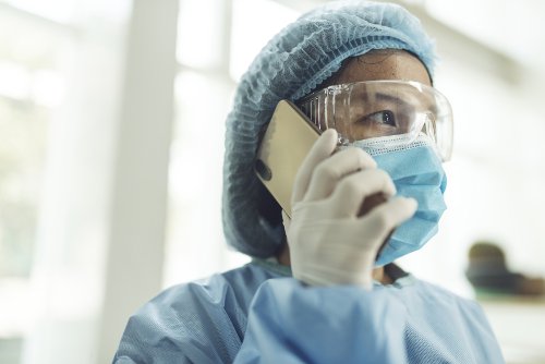 An image of a health care provider on a phone