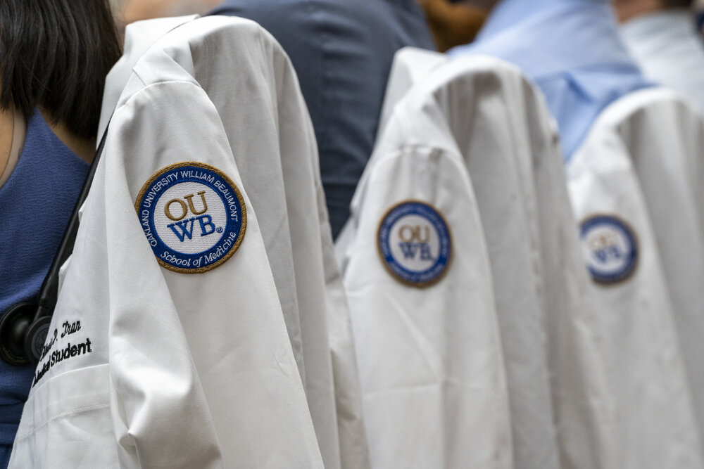 An image of OUWB patches on white coats