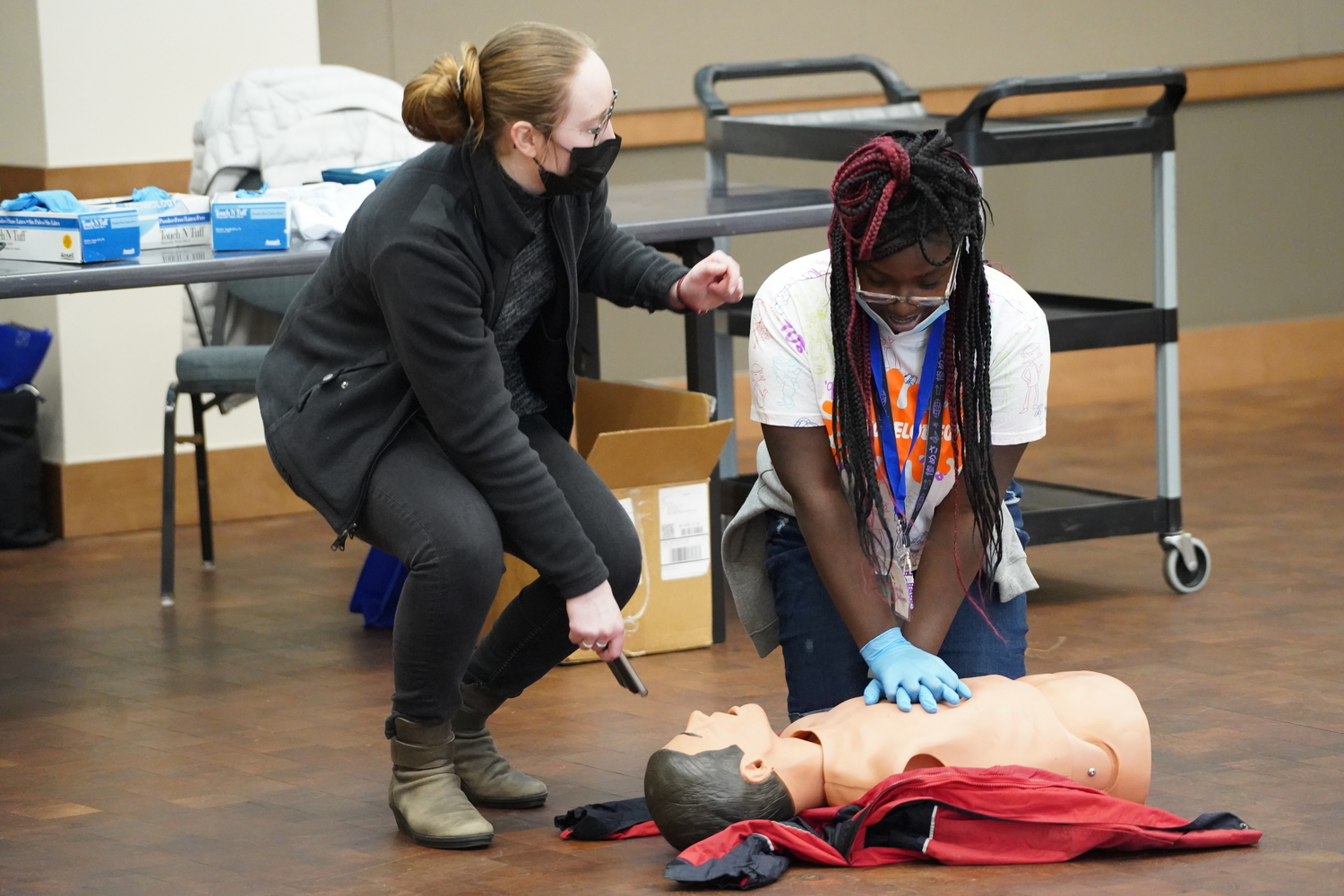 An image of an OUWB student teaching CPR