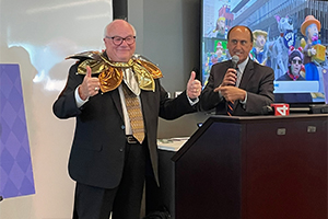 An image of Dr. Mezwa being introduced as Grand Jester