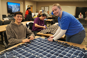 OUWB students making a blanket