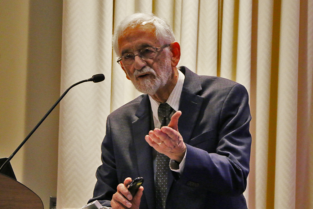 Skeff stands at a podium as he delivers his keynote