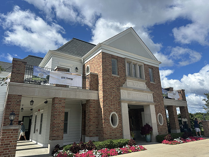 Golf Course Building entrance featuring sponsors' banners