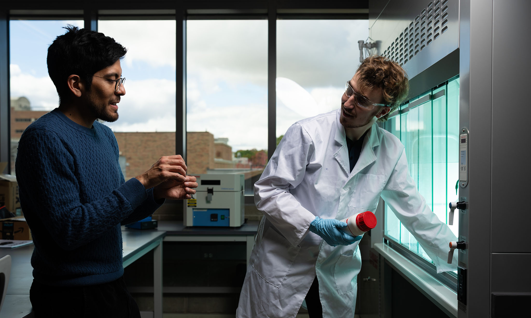 a professor and a student at the lab doing energy research