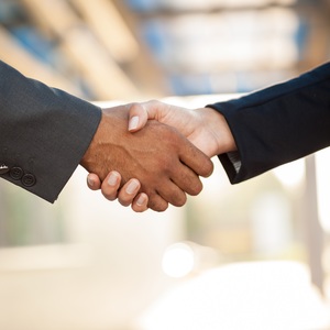 Two people's hands shaking