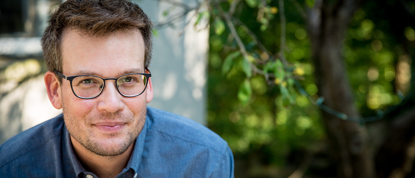 A headshot of John Green